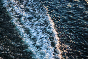 abstract water background with waves and foam