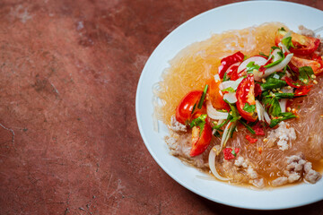 Spicy glass noodle salad with minced pork.