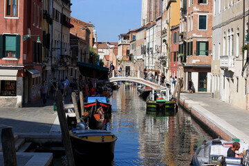 Fototapeta na wymiar canal in Venice with bridge and sunny weather