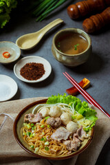 Dry thin noodles with stewed pork and pork ball.