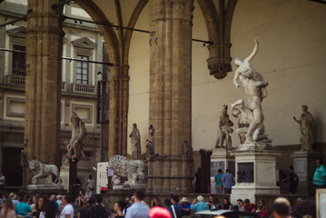 Florence, Italy - August 20, 2018. People in Piazza Signoria in Florence. Sculpture in Piazza Signoria in Florence.