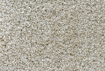 Texture of the beige carpet with soft pile. Carpet background.
