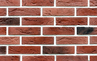Brick wall of red bricks. Background and texture of brickwork.