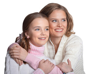 Beautiful mother hugs her daughter on a white background