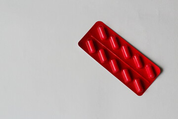 red pills on white background