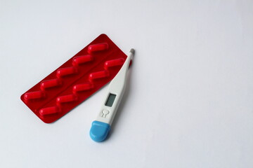 red pills and thermometer