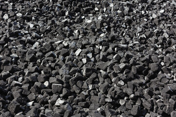 A scattering of gray slag on a sunny day.