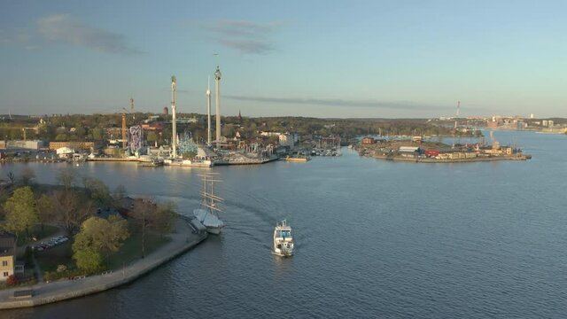 Ferry and Sightseeing boat in front of Gröna Lund amusement park, aerial view