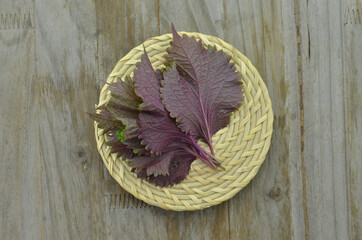 Perilla leaves on wooden background