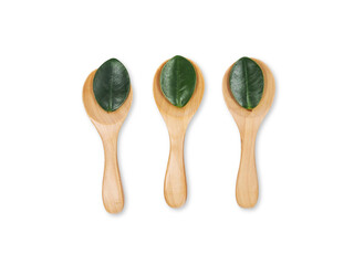 Wooden eating spoon set Environmentally friendly with leaves isolated on white background.