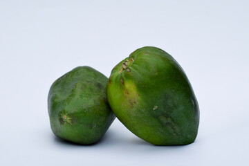 Two Green papaya, papaw or pawpaw or Raw papaya fruit Indian Mexico American 