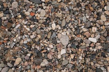 beach varied stones and pebbles background