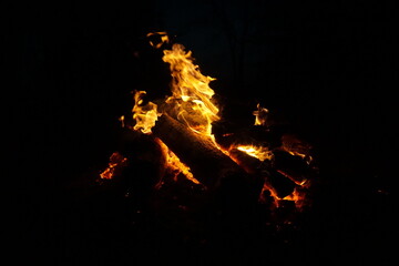 Warm roaring campfire on cool night