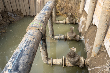 Used muddy water pipe valve in a trench