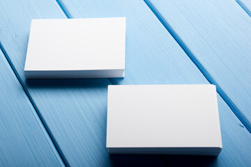 Business card blank on wooden background. Corporate Stationery, Branding Mock-up. Creative designer desk. Flat lay. Copy space for text