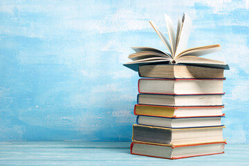 Books on wooden desk table and abstract background. Education background. Copy Space. Back to school.