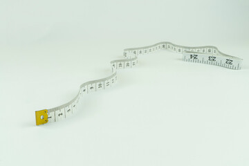 Distance measuring tape on a white background close-up