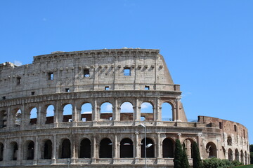 colosseum with clear sky background in rome italy Colosseum in rome is among wonders of world and famous tourist destination and ancient amphitheater once used for gladiator fight 