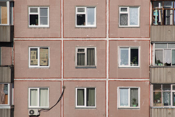 Windows in an old panel apartment building