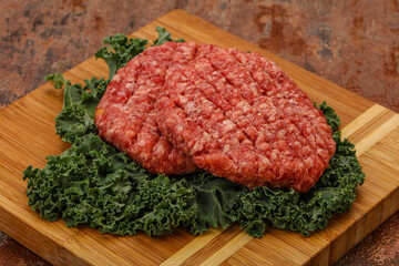 Raw beef burger cutlet for cooking