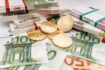 Crypto currency concept - a bitcoin with euro bills. Bitcoin and Euro banknotes. Cryptocurrency lies on the money