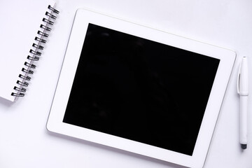 Top view of digital tablet with screen on desk 