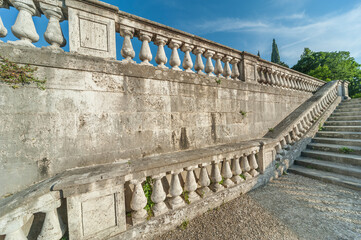 Stone baroque baluster and stairway in garden