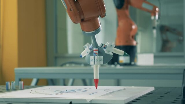 Robotic mechanism is managing a sharpie while drawing