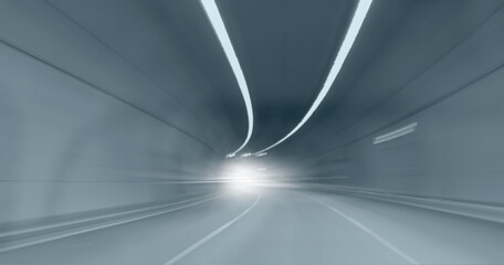 Highway road tunnel with car light 