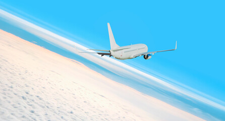 Passenger airplane is rising above the clouds -  White passenger airplane in the clouds  - Travel by air transport