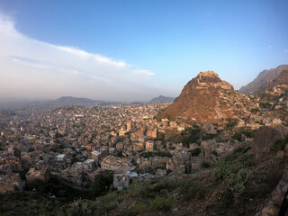 Fototapeta premium A view of Taiz city in Yemen, from the top of the historic castle Sirajiya which also shows the historic Castle Alqahera .