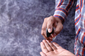 Close up of person hand using sanitizer for preventing virus,