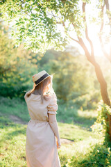 Naklejka premium young girl in a long linen dress, summer photo shoot, a girl in the forest