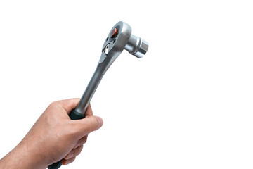 Hand holding socket wrench or ratchet on white backdrop. Automotive industry. Repair service concept.