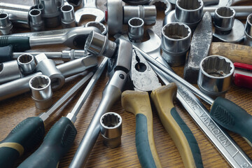 Fototapeta premium Set of car repair hand tools on wooden background. Repair service concept. Diy concept.