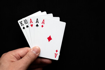 Fototapeta premium Three of a kind combination in poker on black background. Poker combinations concept.