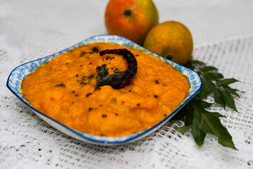 Goan Mango Curry dish with copy space. Restaurant and food magazine image of mango curry.  Goan Mango Sasav dish.