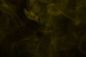 Yellow steam on a black background.