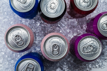 Group of aluminium cans in ice, cold drink.