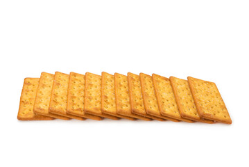 Cracker with salt isolated on white.