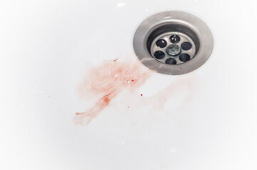 gums bleed when brush the teeth and blood in toothpaste foam on white sink