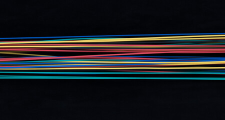 set of colored wires on a black background