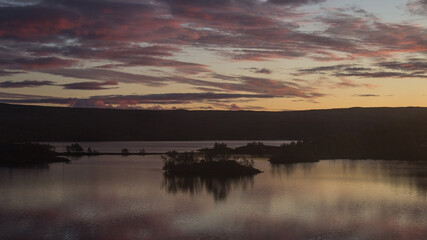 sunset over the fjord lake in Norway