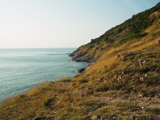 View of the moutain grass and sea in good weather day.