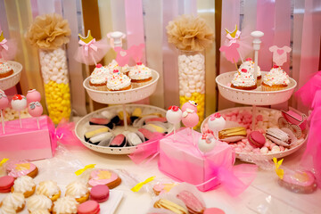 these are pink desserts on the children's table