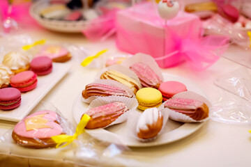 these are pink desserts on the children's table