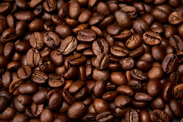 Roasted black coffee grains, can be used as background.
