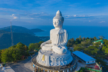 Fototapeta premium aerial view blue sky and blue ocean are on the back of Phuket Big Buddha statue..white Phuket big Buddha is the one of landmarks on Phuket island..