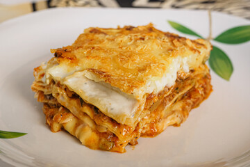 Portion of Italian lasagna stuffed with meat and vegetables