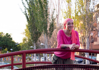 Young happy cancer survivor outdoors